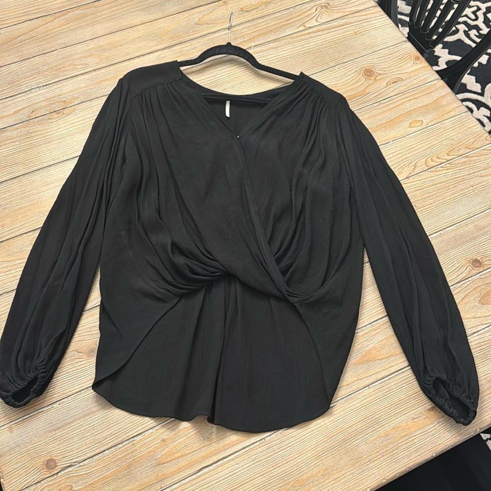 Free people blouse. High low cross front size medium black